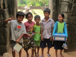 Khmer children at entrance of Bakong Temple tower
